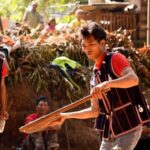 Deang Ethnic Villagers Spin Tops to Celebrate the Spring Festival 
