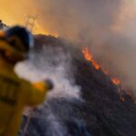 Los Angeles Races to Contain Wildfires Before High Winds Return 