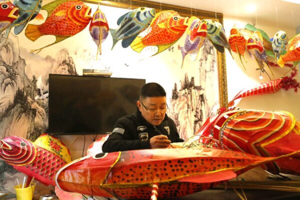 Meet the Artisan Preserving Fish Lantern Traditions for Chinese New Year Making fish lanterns to welcome Spring Festival