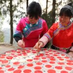 Tujia People Prepare Traditional Food for New Year Celebration 